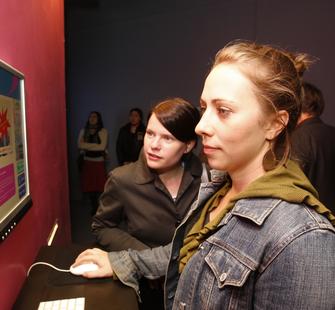 Visitors book their ticket to Baghdad at AT Opening Receoption, 11/17/07