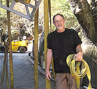 David Middlebrook poses with his sculpture, Haywire
