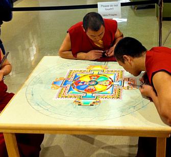 Tibetan monks working on the Sand Mandala