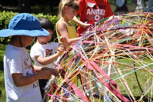 Kids add ribbon at Arts Splash