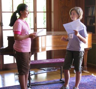 Two young actresses practice their lines.