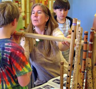 Students and teacher working on bamboo flutes