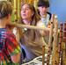 Students and teacher working on bamboo flutes
